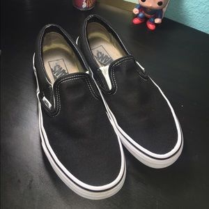 Black/white vans slip ons