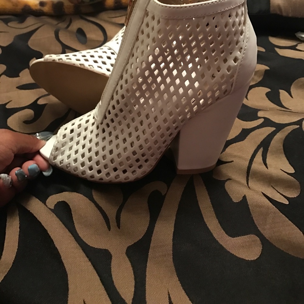 White open toe booties.