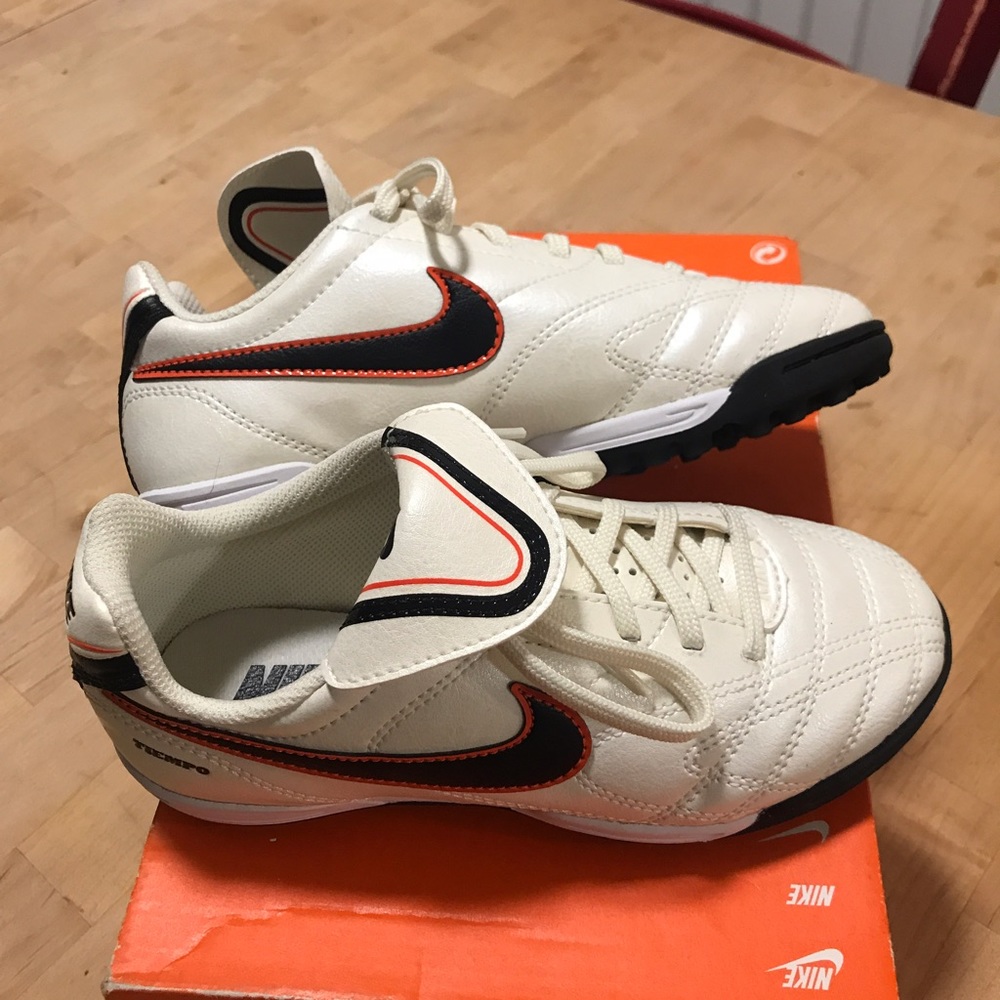 Nike junior Tiempo III TF-pearl, black and orange.