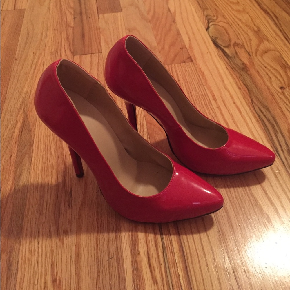 Never worn patent leather red bottom knockoffs.