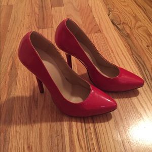 Never worn patent leather red bottom knockoffs.