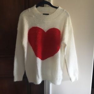 White soft sweater with heart on the front