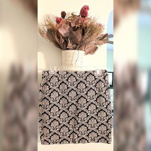 Black and tan mini body con skirt