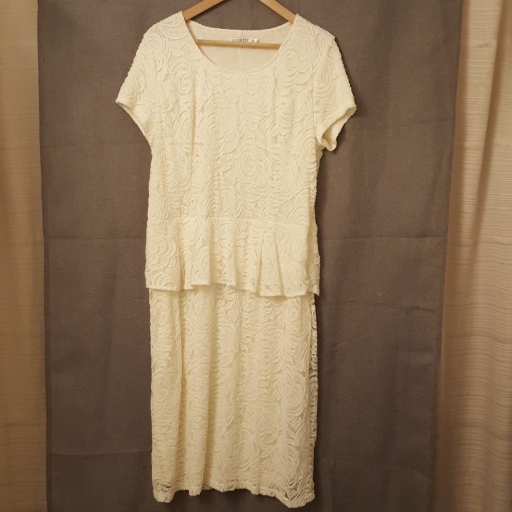 Beautiful cream lace peplum dress