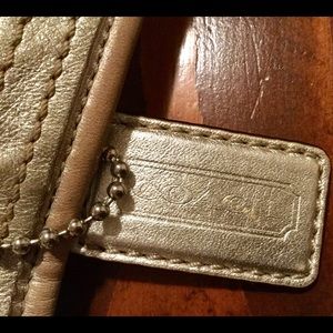 Tan and silver coach purse