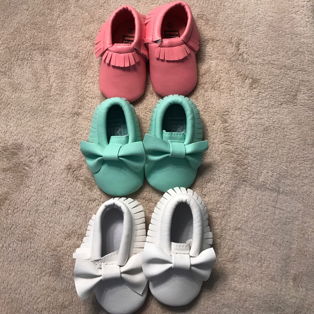 Three pair of baby moccasins. Like new condition