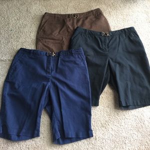 Three pairs of walking shorts with gold buckle