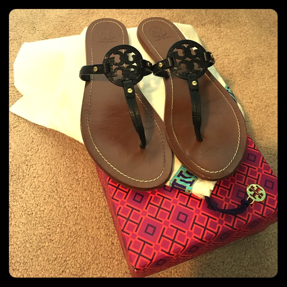 Tory Burch black mini miller sandals.