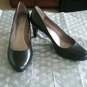 Black leather pumps