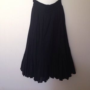 Long flowing black gauze skirt.