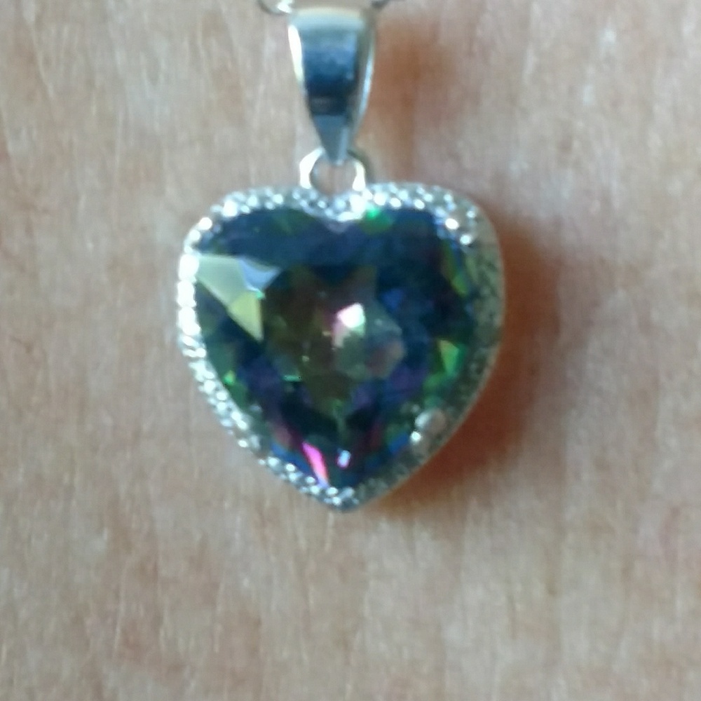 .5 ct diamonds surrounding a 3 ct mystic topaz