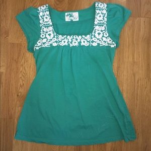 Green top with white embroidery