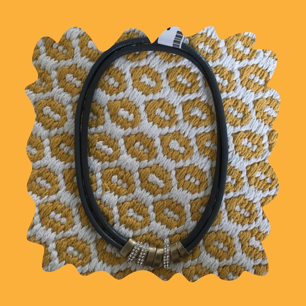 Gray corded magnetic choker necklace.