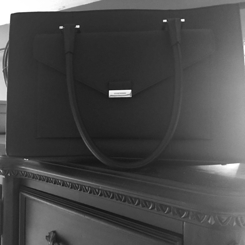 Cole Haan black leather purse with shoulder strap.