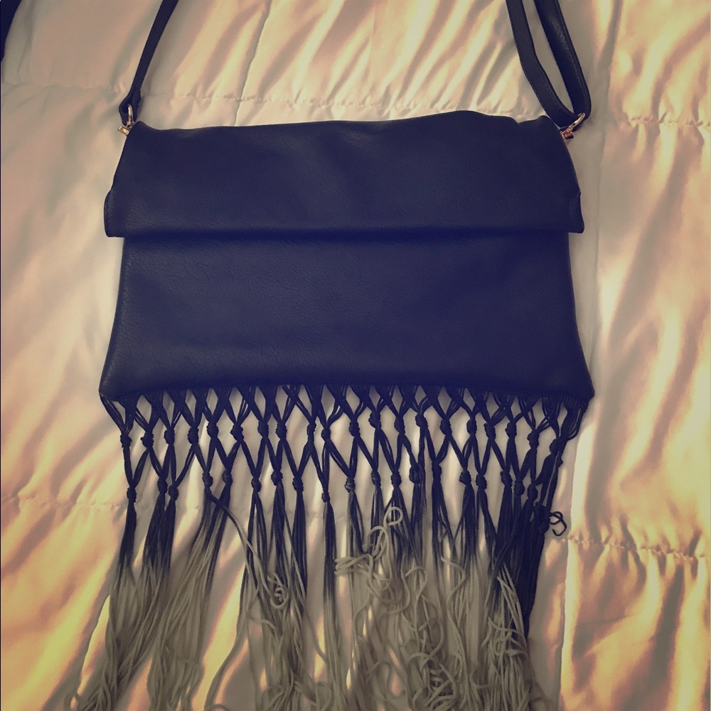 Black cross body or clutch fringe purse!