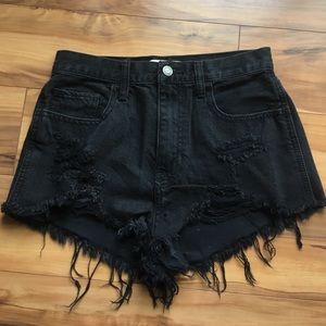 Hollister faded black distressed denim shorts.