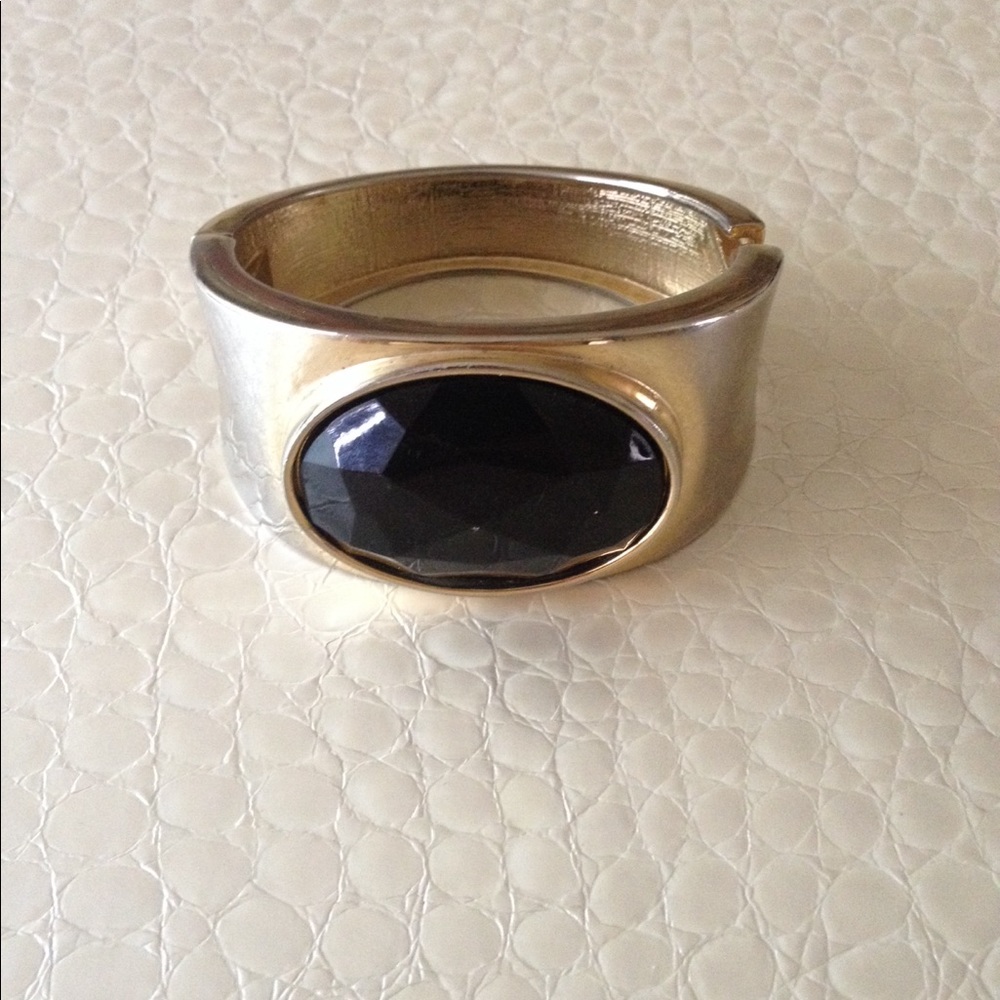 Gold tone bangle with big black jewel