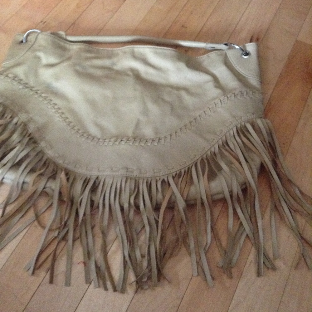 Tan colored purse with fringe