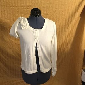 Cute white cardigan with gathered sleeve cuffs.