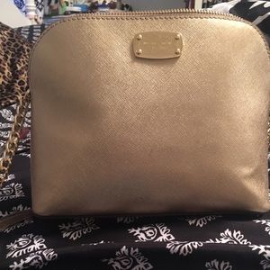 Authentic Michael Kors gold metallic cross body.
