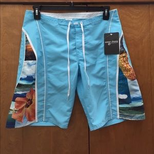NWOT Board shorts light blue Hawaii- themed side