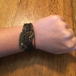 Brown multi strand bracelet with gold charms