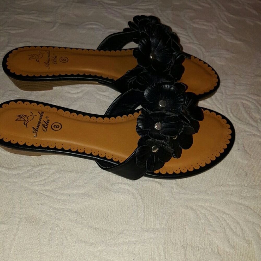 Black leather thong shoes.