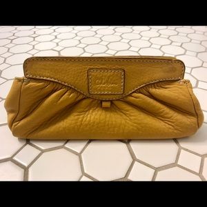 Mustard yellow Cole Haan leather pouch