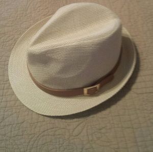 Cream straw hat with brown leather accent