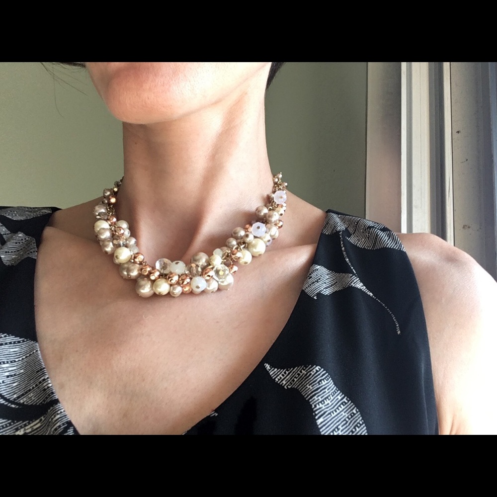 Golden pearl copper and steel necklace.