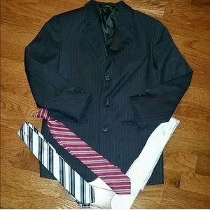 Suit jacket with three different ties.
