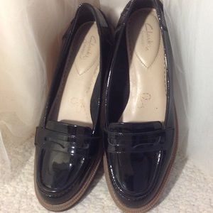 Black patent leather loafers.