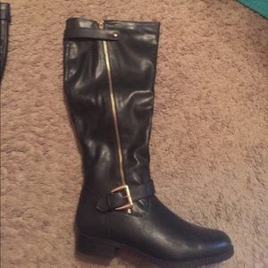 Black faux leather boots. Good zipper accent