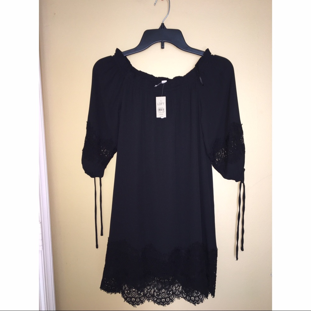 Off the shoulder black dress.