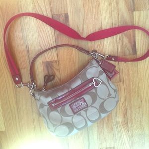 Tan and red Coach crossbody/handbag.