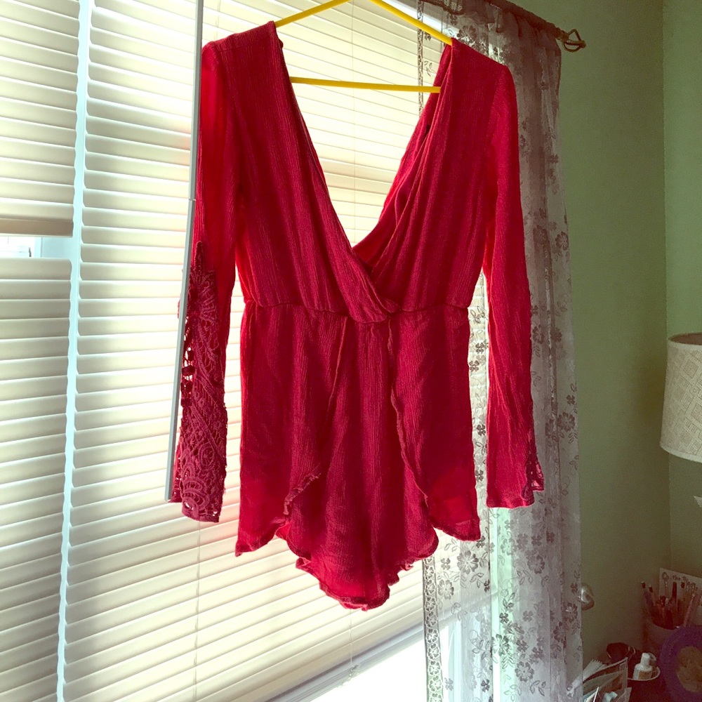 Poppy colored romper will bell sleeves