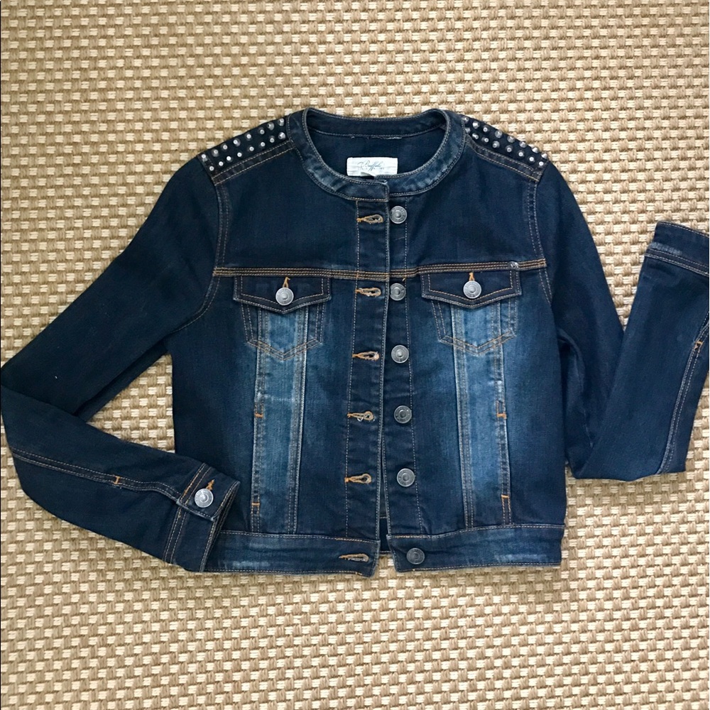 Denim jacket with edgy studded shoulders