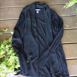 Black cardigan sweater with coordinating trim.