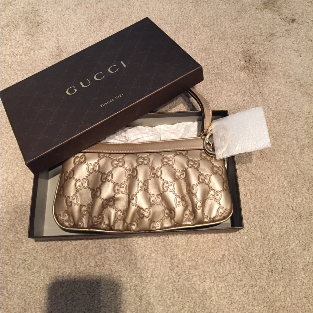 Authentic Gold Gucci Signature wristlet