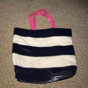 blue and white striped bag w/ a hot pink handle