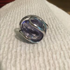 Silver ring with purple gem