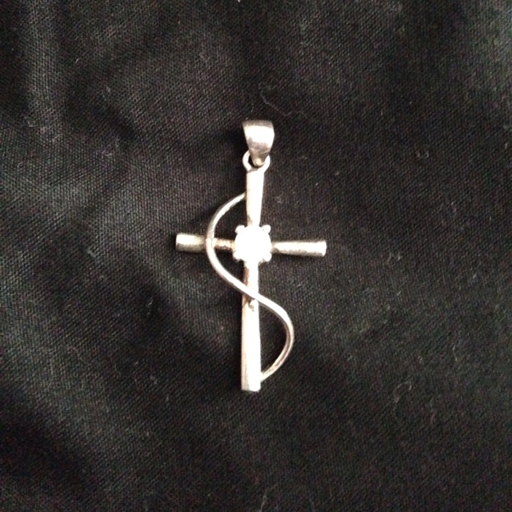 Cross pendant with diamond stud