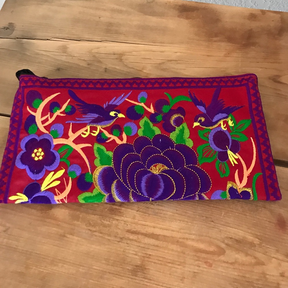 Embroidered wristlet clutch
