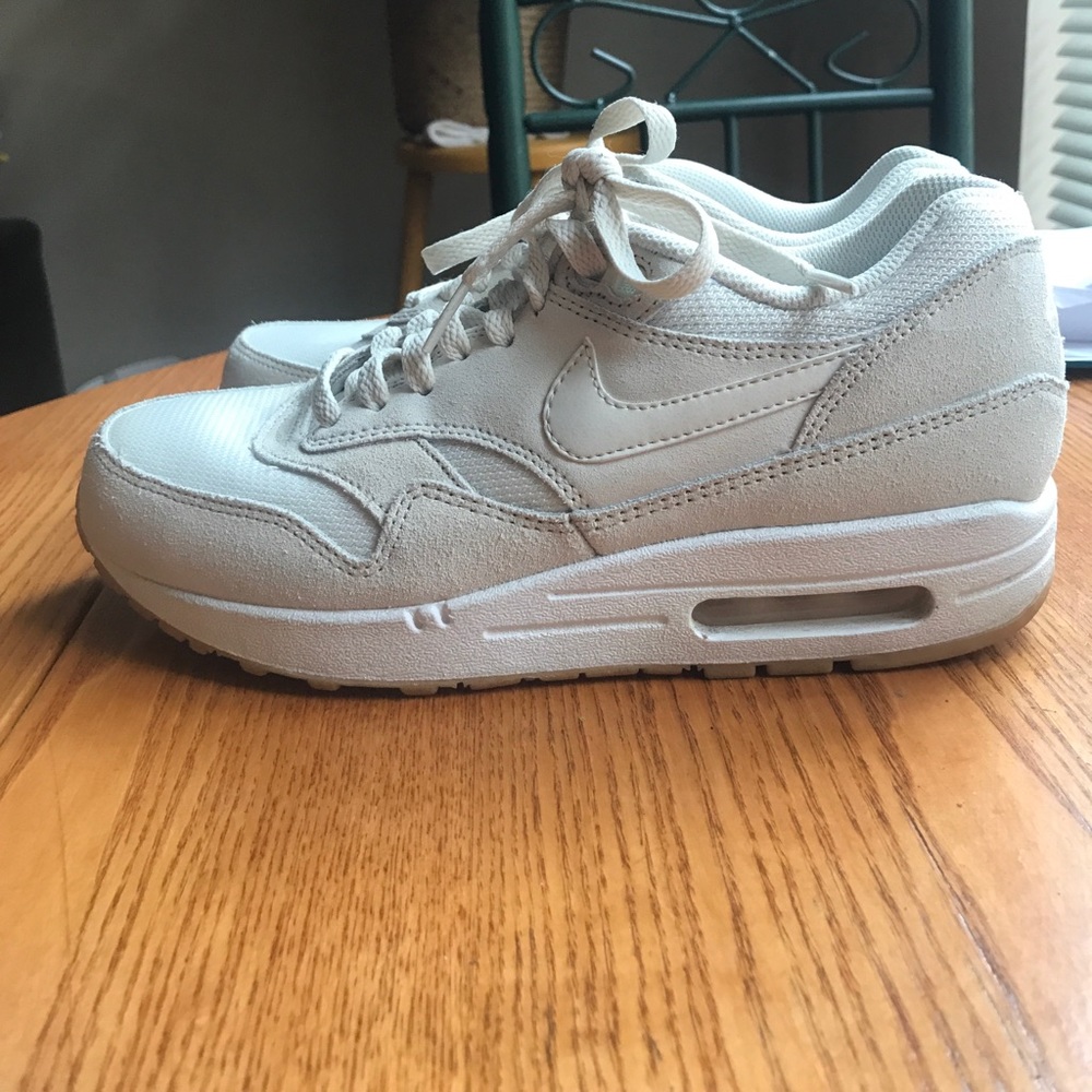 Nike air cream and white tennis shoes
