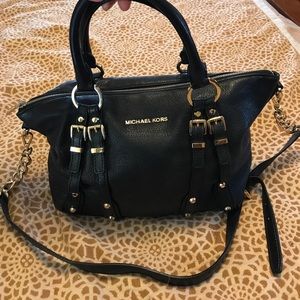 Michael Kors. Jet black with gold metal accents