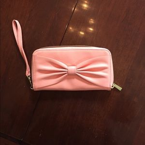 Big bow faux leather wallet in peach