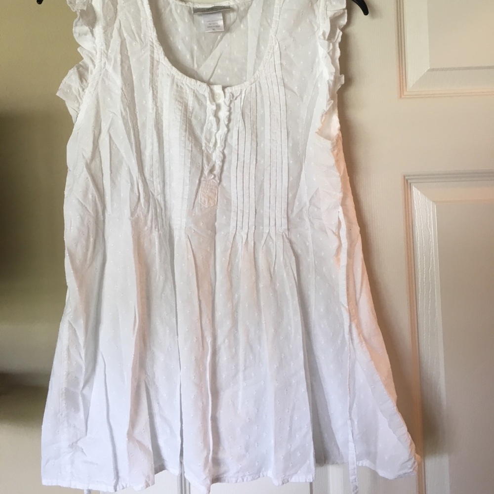 White eyelet maternity blouse.