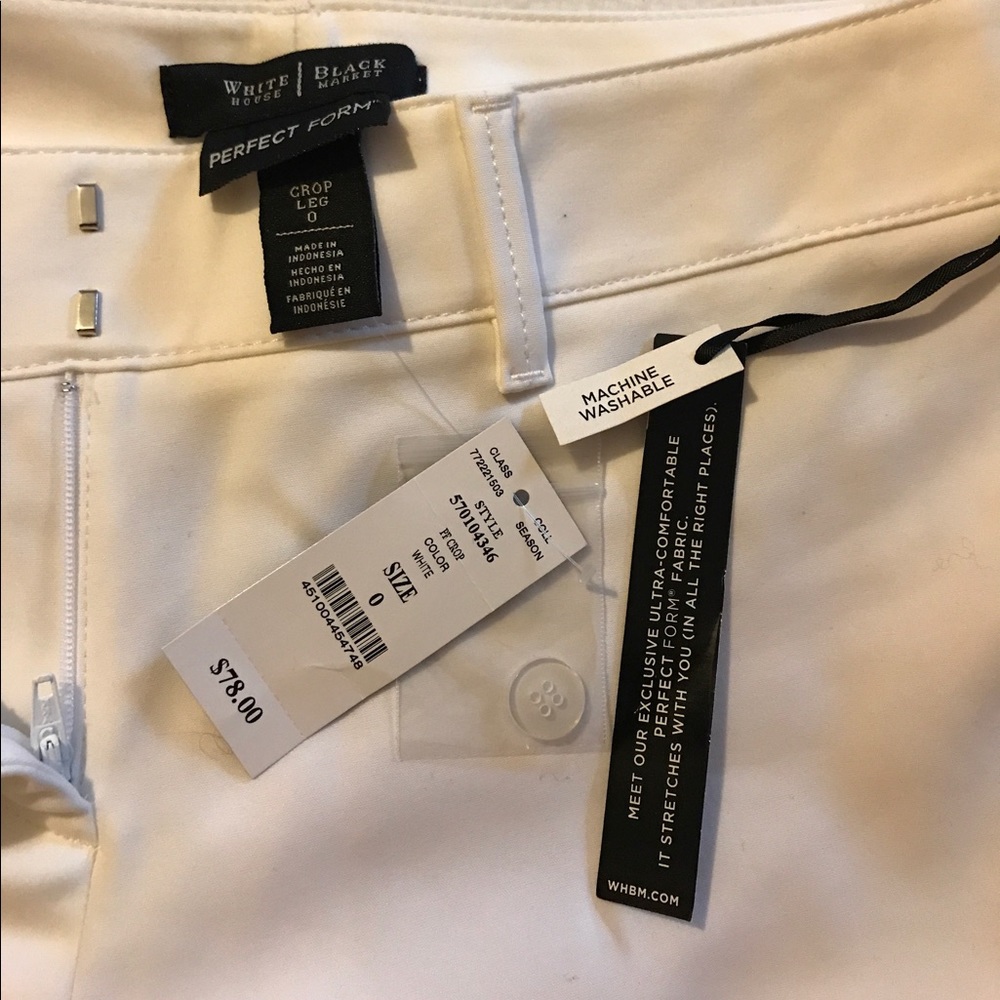 Cropped white trousers