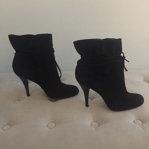 Black Calvin Klein suede ankle boot.
