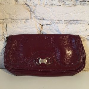 Michael Kors maroon patent leather clutch